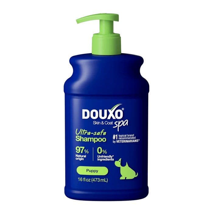 Flacon Douxo SPA Shampoing Chiot 250 ml bleu et vert, soin doux pour le pelage et la peau sensible des jeunes chiens.